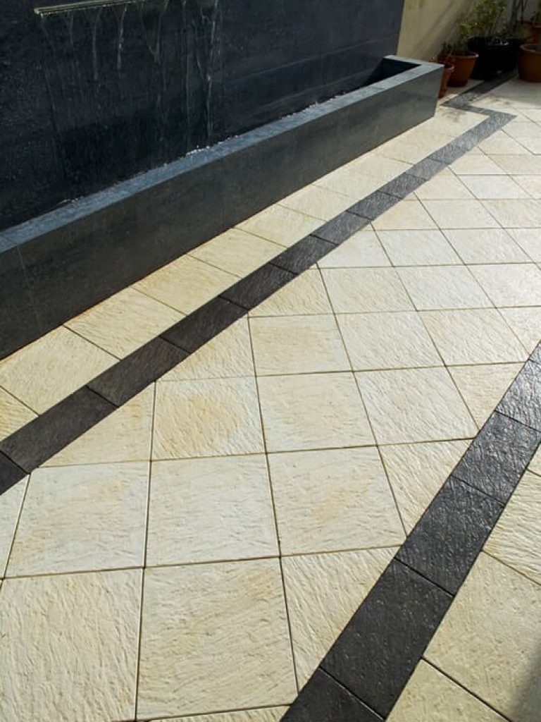 Diamond pattern laid pavers with Castlestone Beach Charcoal Standard Border